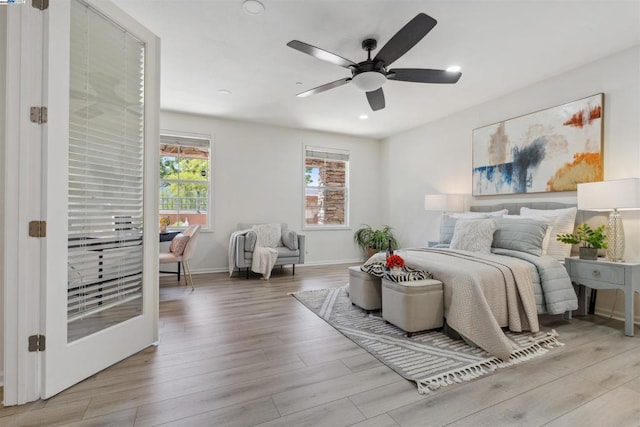 bedroom featuring ceiling fan and light wood-type flooring