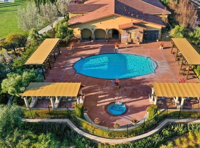 view of swimming pool featuring a patio area