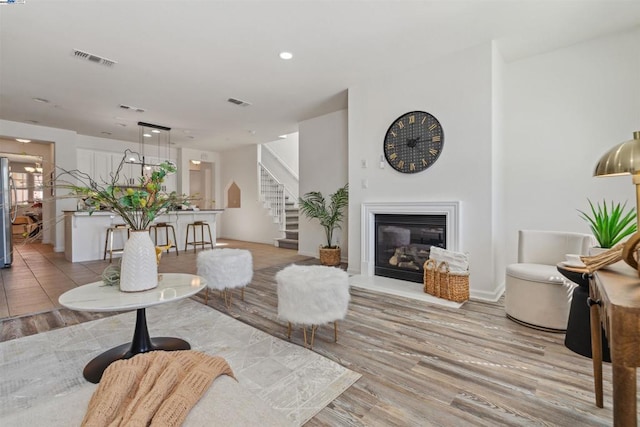 living room with light hardwood / wood-style flooring