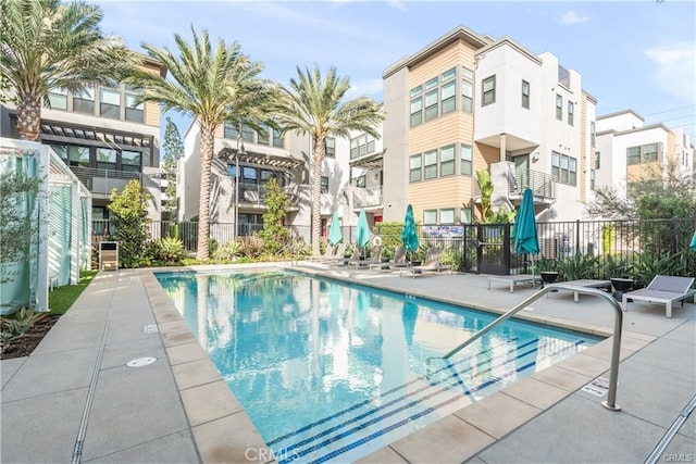 view of swimming pool featuring a patio area