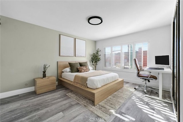 bedroom with light hardwood / wood-style floors