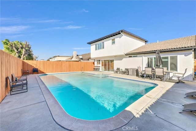 view of swimming pool with a patio