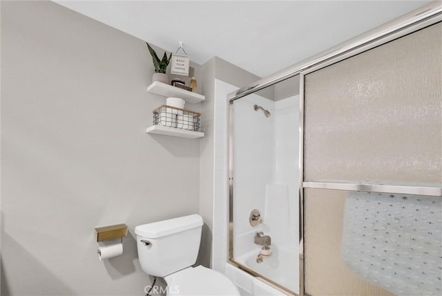 bathroom featuring toilet and enclosed tub / shower combo