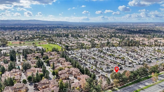 birds eye view of property with a mountain view