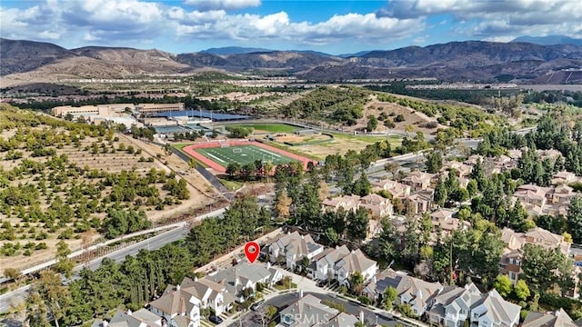 birds eye view of property with a mountain view