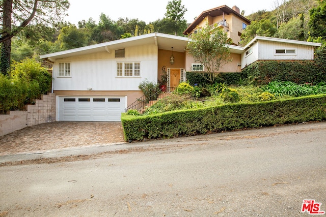 view of front of property with a garage