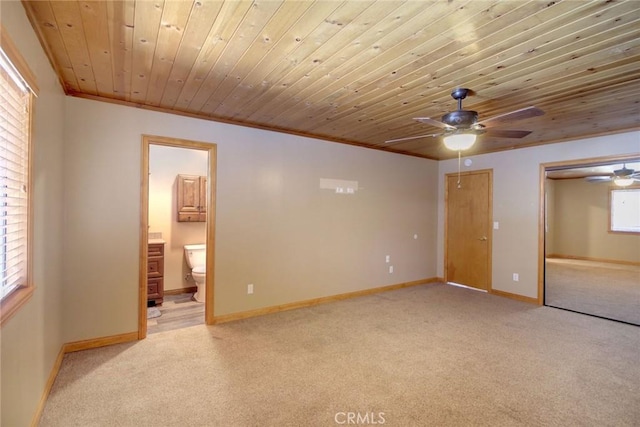 spare room featuring a wealth of natural light, ornamental molding, and wood ceiling