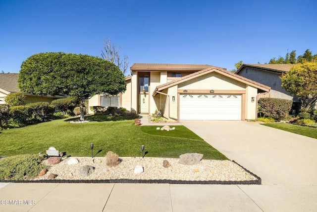 view of front of home featuring a front yard and a garage