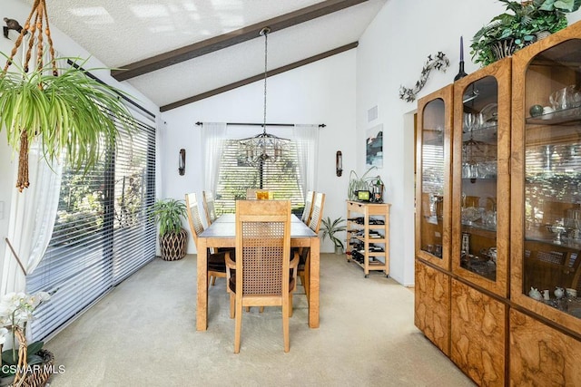 dining area featuring a notable chandelier, light colored carpet, high vaulted ceiling, and beamed ceiling