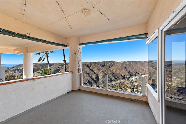 balcony featuring a mountain view