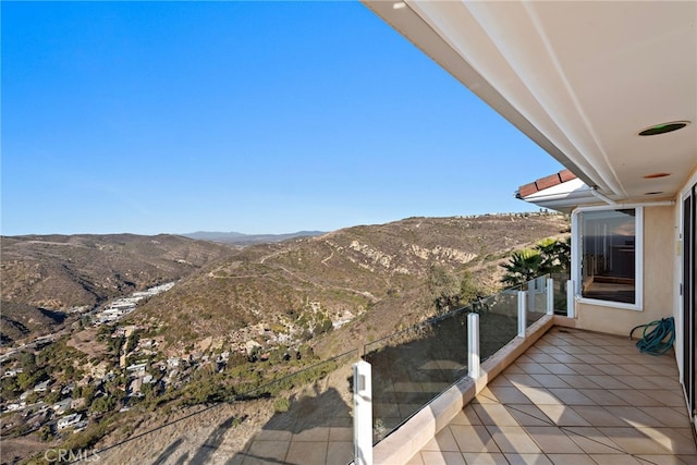 balcony featuring a mountain view