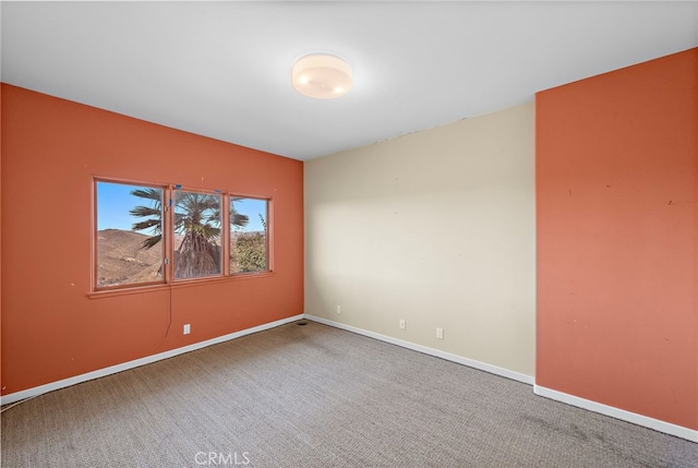 empty room featuring carpet flooring