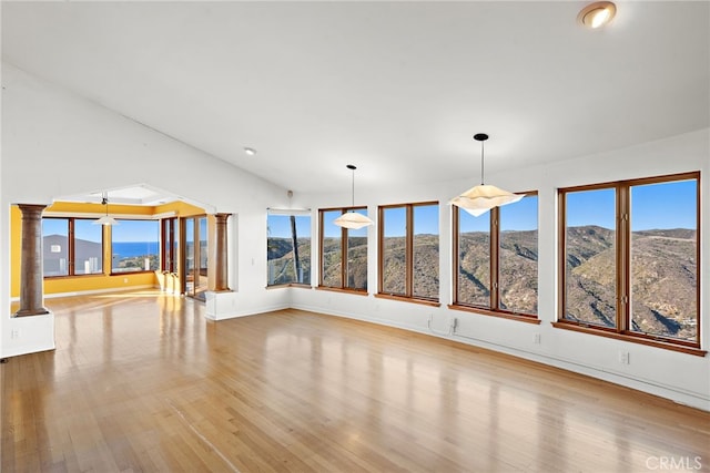 interior space featuring light wood-type flooring and a mountain view