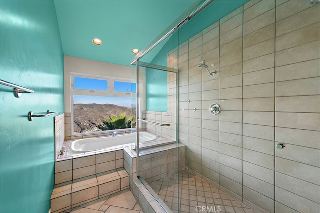 bathroom with tile patterned flooring, plus walk in shower, and a mountain view