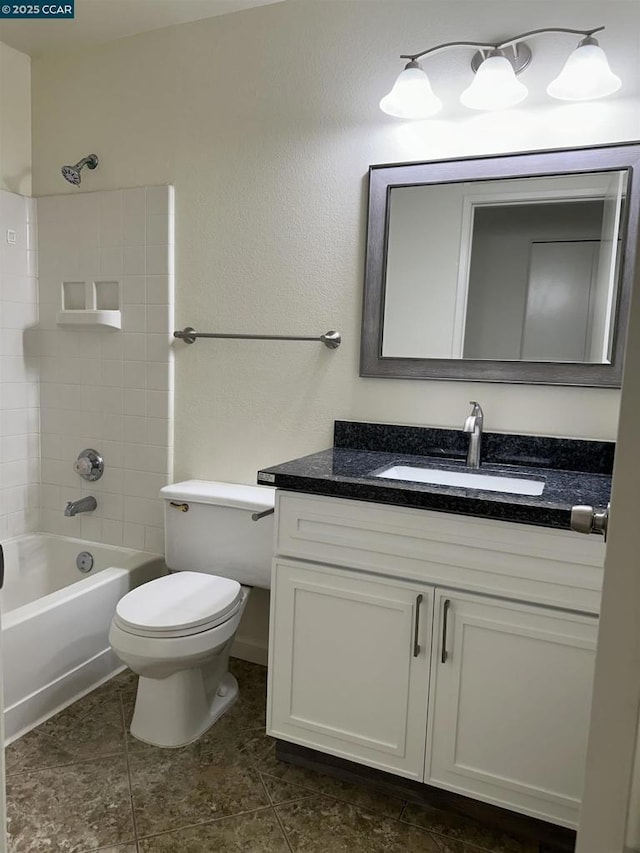 full bathroom with toilet, tiled shower / bath combo, and vanity