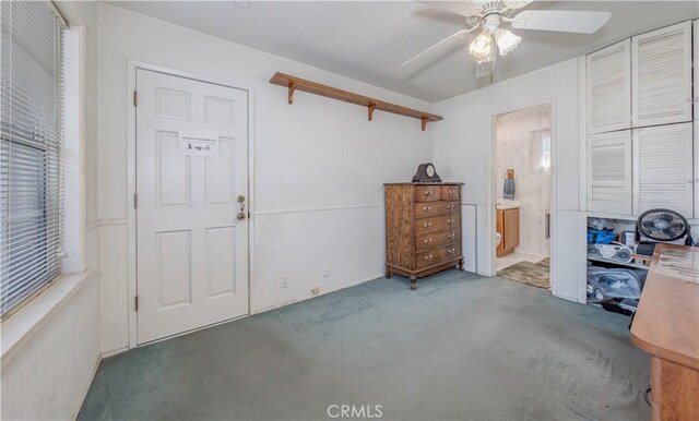 interior space featuring ceiling fan