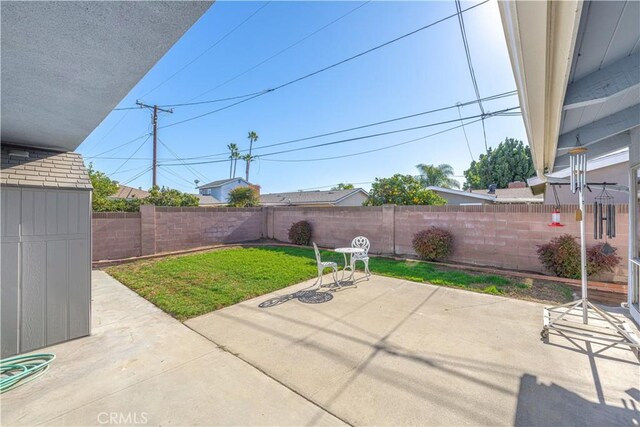 view of patio / terrace featuring a shed