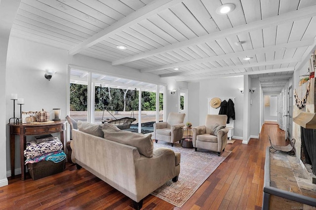 living room featuring beam ceiling and dark wood-type flooring