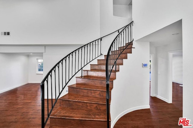 staircase featuring hardwood / wood-style floors