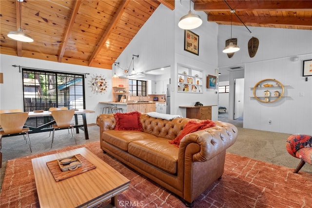 carpeted living room featuring high vaulted ceiling, wooden ceiling, and beamed ceiling