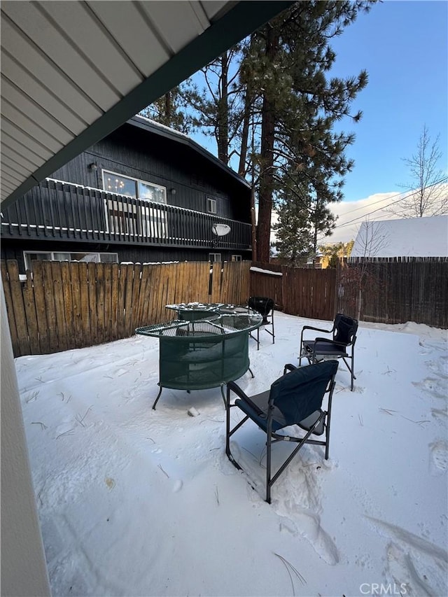 view of snow covered patio