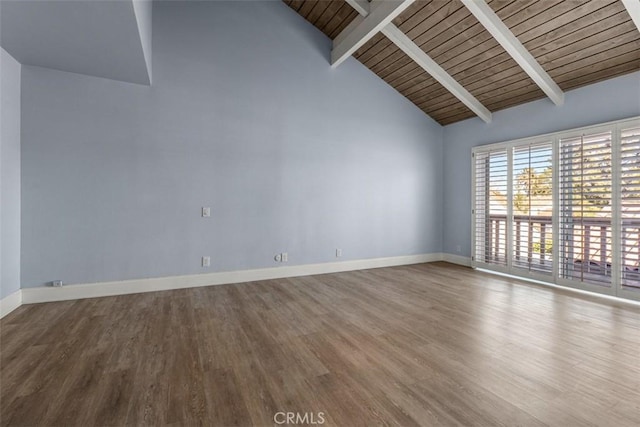 spare room with wood finished floors, high vaulted ceiling, wooden ceiling, beamed ceiling, and baseboards