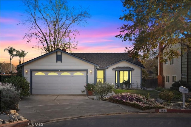 ranch-style house featuring a garage