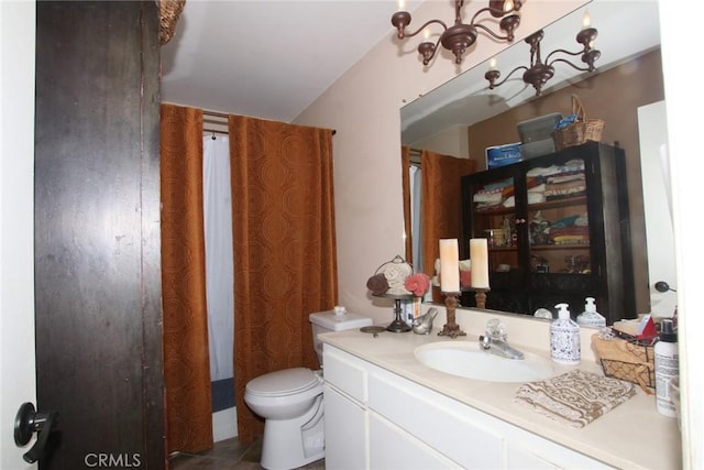 bathroom featuring toilet and vanity