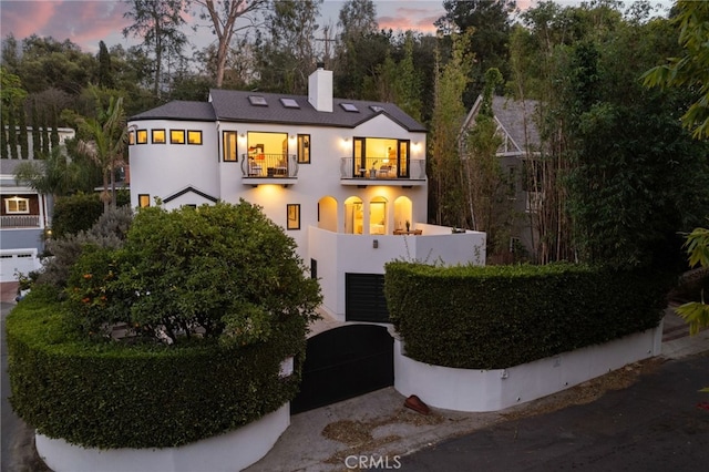 view of front of home featuring a balcony