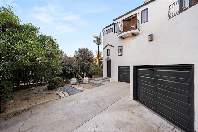 view of property exterior featuring a garage