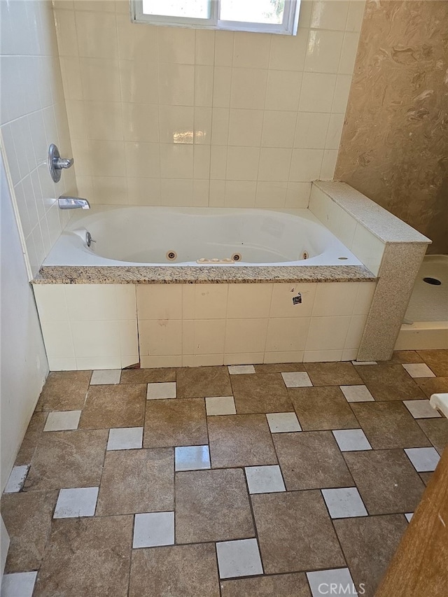 bathroom with tiled bath