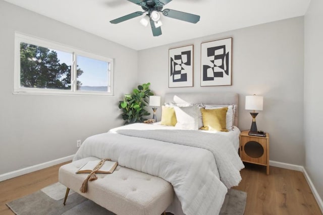 bedroom featuring ceiling fan and wood-type flooring