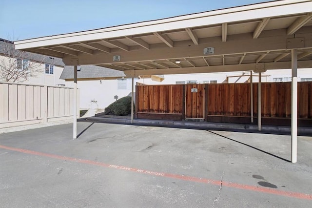 view of parking with a carport