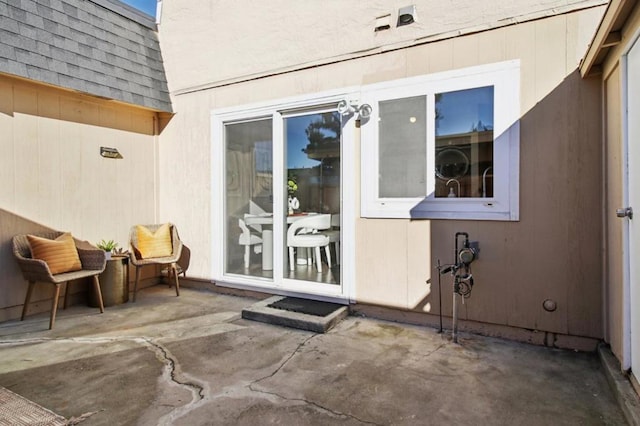 property entrance with a patio area