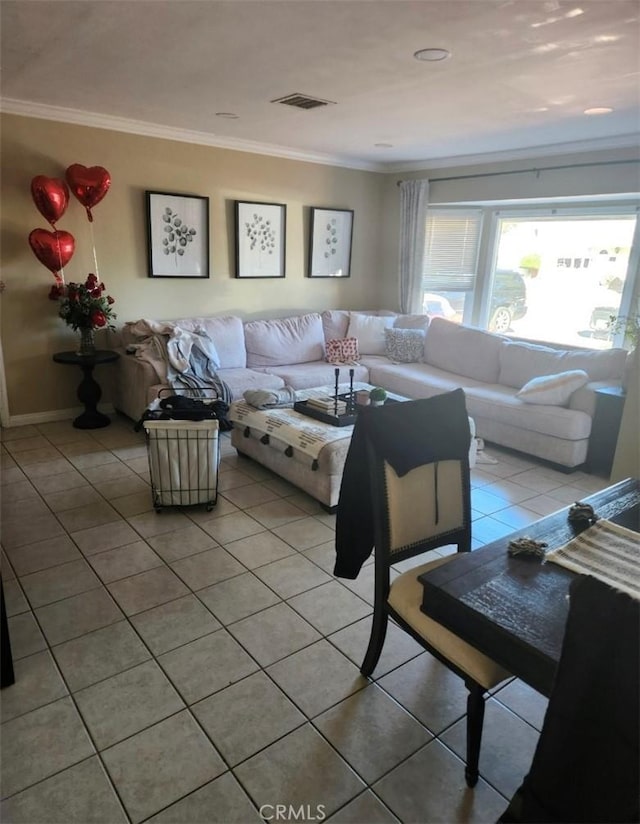 living room featuring light tile patterned floors, visible vents, and crown molding