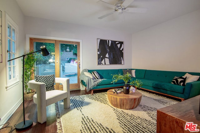 living room with hardwood / wood-style flooring, plenty of natural light, and ceiling fan