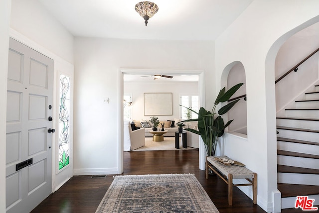 entrance foyer featuring ceiling fan and dark hardwood / wood-style flooring