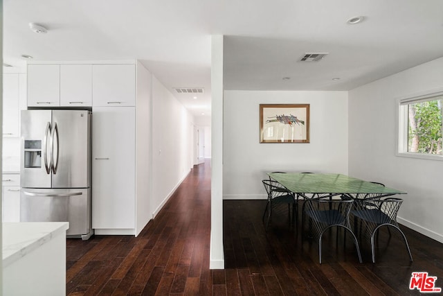 dining area with dark hardwood / wood-style floors