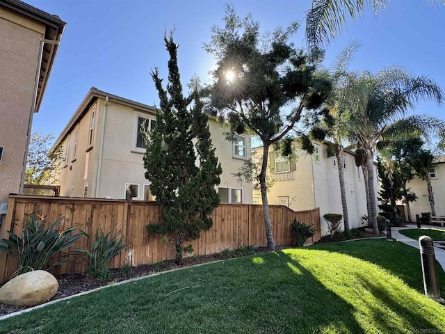 view of property exterior with a yard