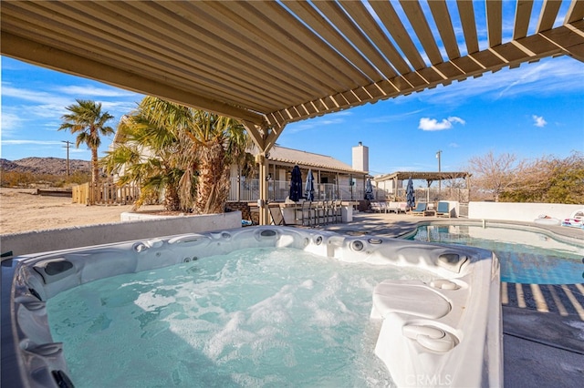 view of pool featuring a jacuzzi, a pergola, and a bar