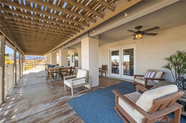 view of patio / terrace with french doors, a pergola, and ceiling fan