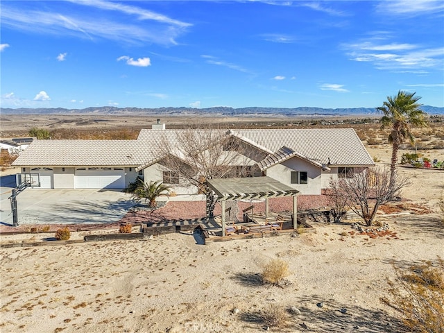 drone / aerial view with a mountain view and a desert view