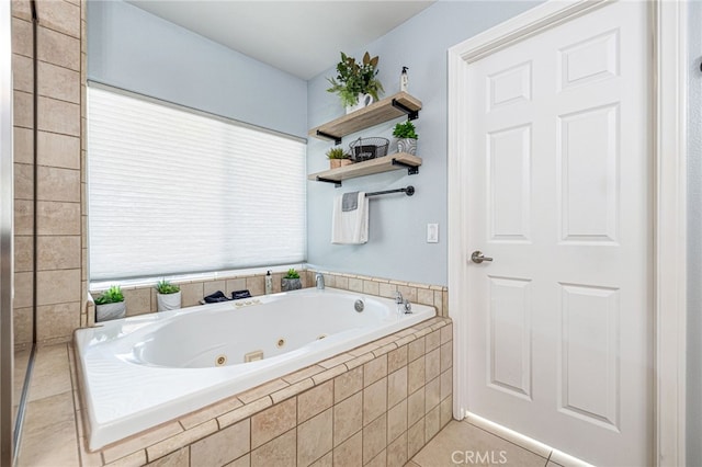 bathroom featuring tile patterned floors and tiled tub