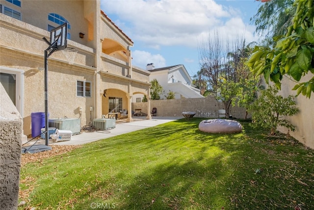 view of yard featuring a patio area and central AC