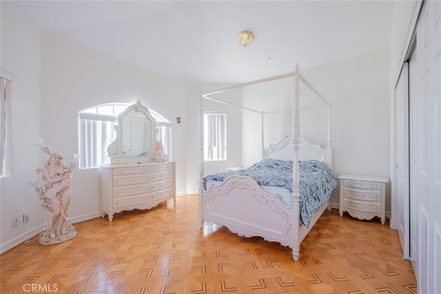 bedroom featuring light parquet floors