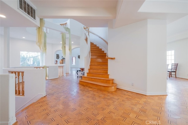 staircase with parquet flooring