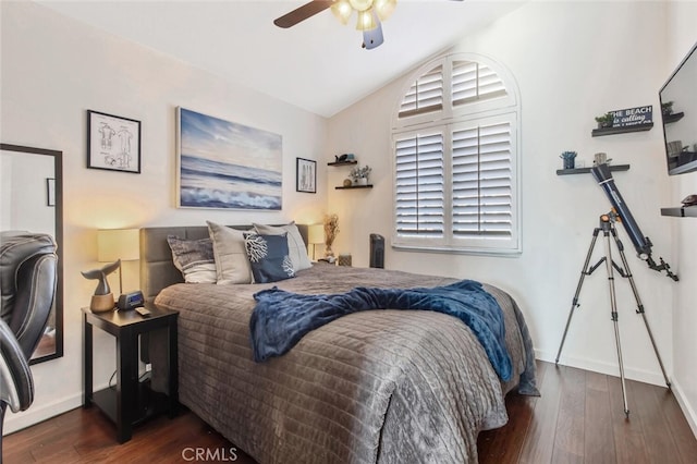 bedroom with lofted ceiling, dark wood finished floors, baseboards, and ceiling fan