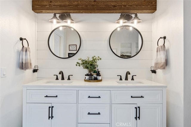 full bath with double vanity and a sink