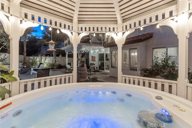 view of pool with a patio, a hot tub, and a gazebo