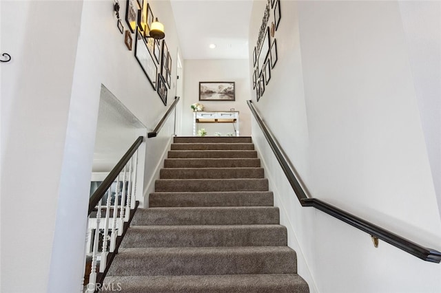 stairway featuring recessed lighting